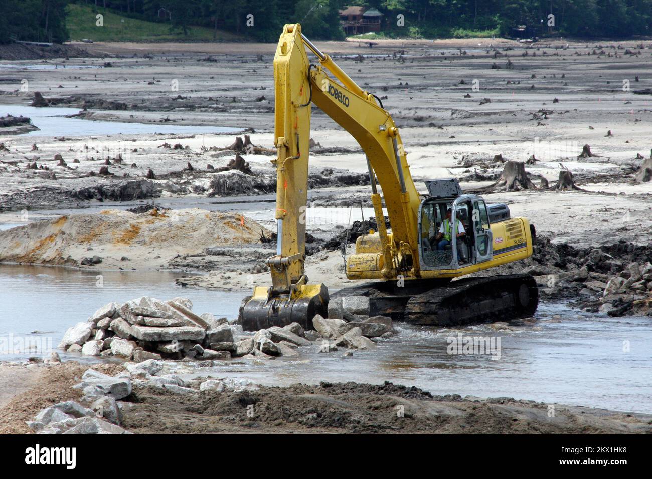 Severe Storms, Tornadoes, and Flooding,  Lake Delton, WI, June 23, 2008   Track loader is moving debris in a lake bed in Wisconsin to repair and rebuild a dam. Lake Delton was emptied when a dam broke. This 297 acre lake was a source of summer tourist revenue which is now lost for the season. Robert Kaufmann/FEMA.. Photographs Relating to Disasters and Emergency Management Programs, Activities, and Officials Stock Photo