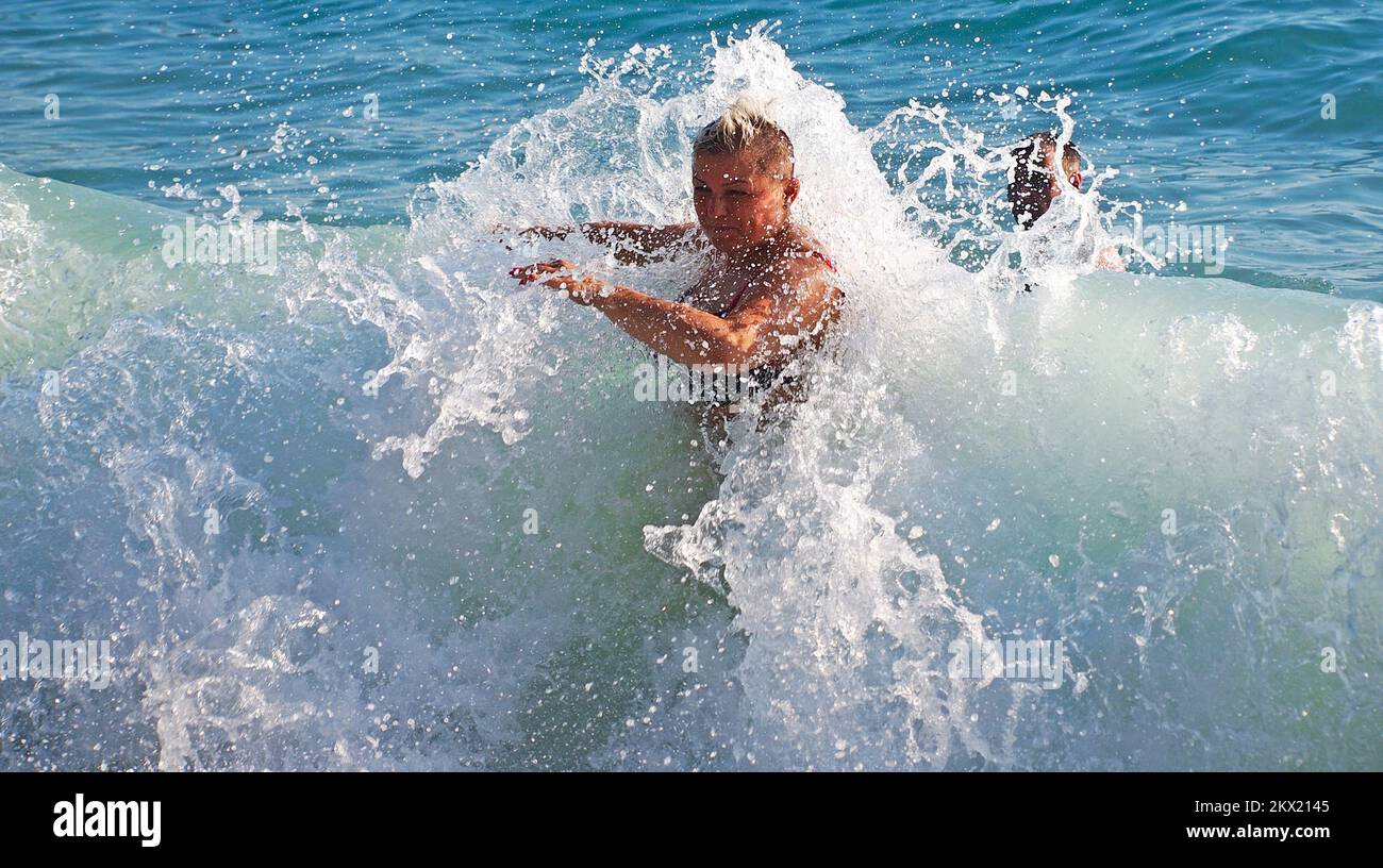 07.08.2017., Makarska, Croatia - Tourists enjoy the tramontane waves. Photo: Toni Katic/HaloPix/PIXSELL Stock Photo