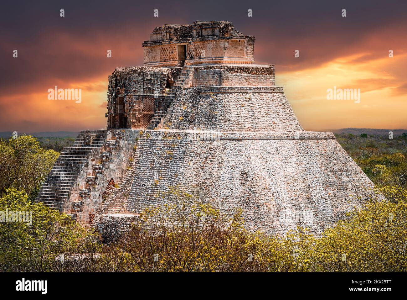 Uxmal, Mexico. Pyramid of the Magician in ancient jungle Mayan city Uxmal, Yucatan Peninsula. Stock Photo