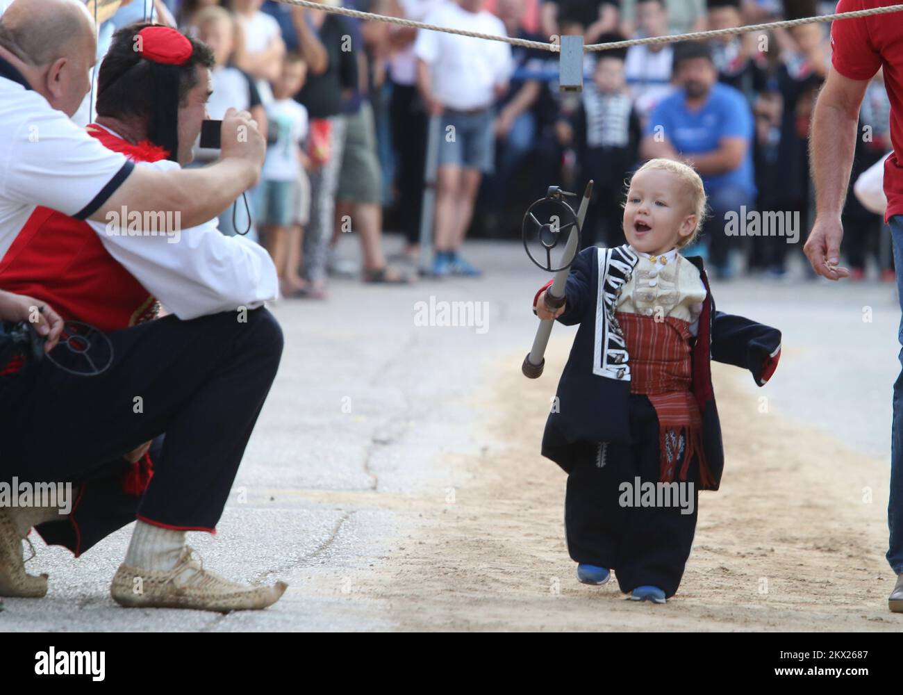 20.08.2017., Brnaze, Croatia - Alkar Veseli (Happy) runs during the Children's Alka tournament in Vuckovici village, Croatia, August 20, 2017. Children's Alka is a tournament which has been held every August in the Croatian village of Vuckovici since 1955. in memory of their ancestors Father Pavao, Boze, Tadija and Zec, whose heroism and bravery made them become prominent in the decisive battle against the Ottomans in 1715. Only boys up to 10 years can participate. Photo: Ivo Cagalj/PIXSELL Stock Photo
