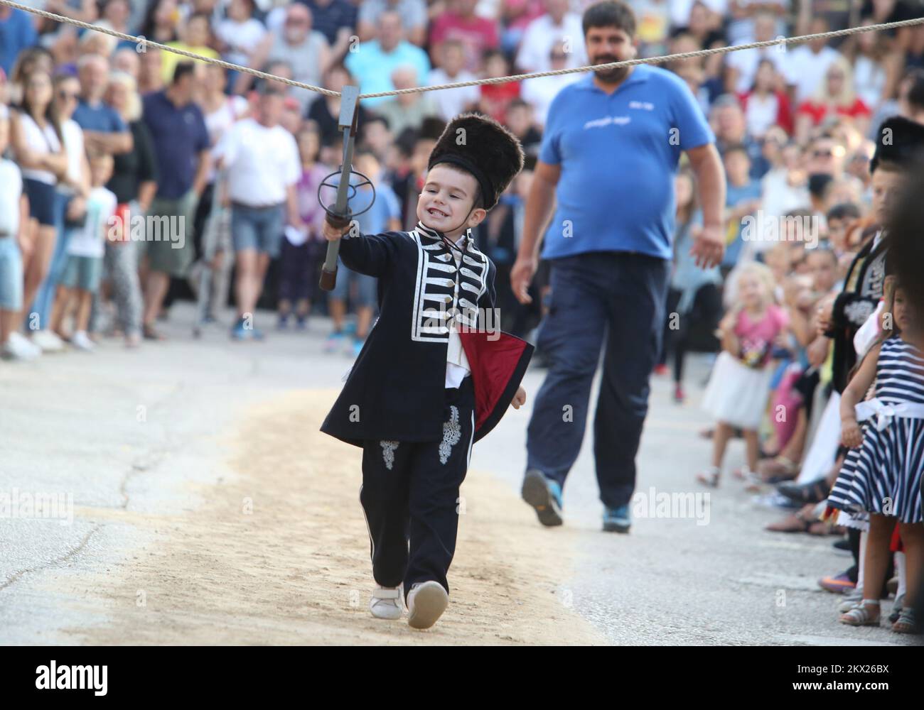 20.08.2017., Brnaze, Croatia - Alkar Fico runs during the Children's Alka tournament in Vuckovici village, Croatia, August 20, 2017. Children's Alka is a tournament which has been held every August in the Croatian village of Vuckovici since 1955. in memory of their ancestors Father Pavao, Boze, Tadija and Zec, whose heroism and bravery made them become prominent in the decisive battle against the Ottomans in 1715. Only boys up to 10 years can participate. Photo: Ivo Cagalj/PIXSELL Stock Photo