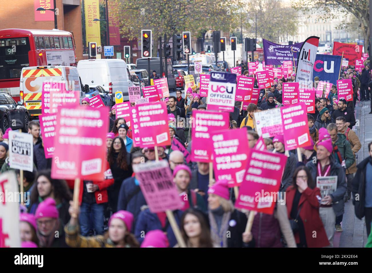 Protesters march along Euston Road near Kings Cross Station, London, during a rally as members of the University and College Union (UCU) take part 24-hour stoppage among university staff in an ongoing dispute over pay, pensions and conditions. Picture date: Wednesday November 30, 2022. Stock Photo