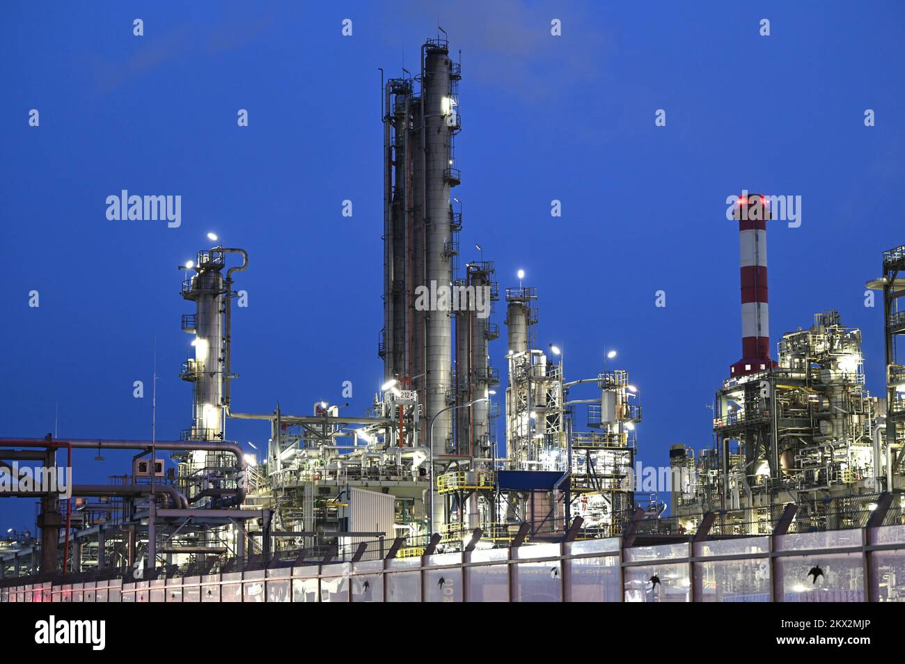 Illuminated OMV refinery in Schwechat, Lower Austria, at night Stock Photo