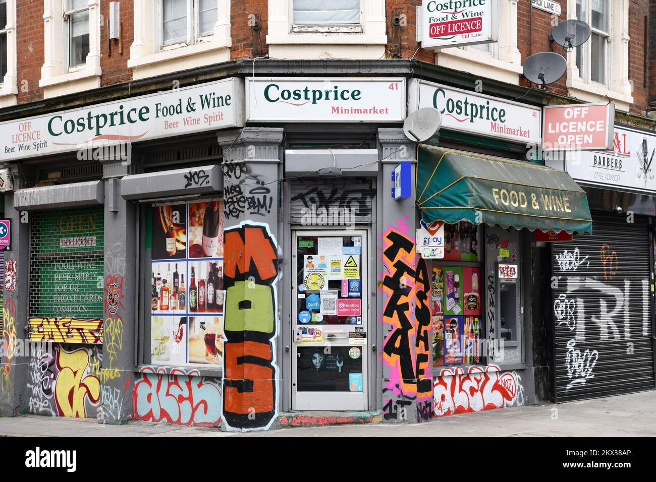 Costprice minimarket covered in graffiti on corner of Brick Lane and Fashion Street In