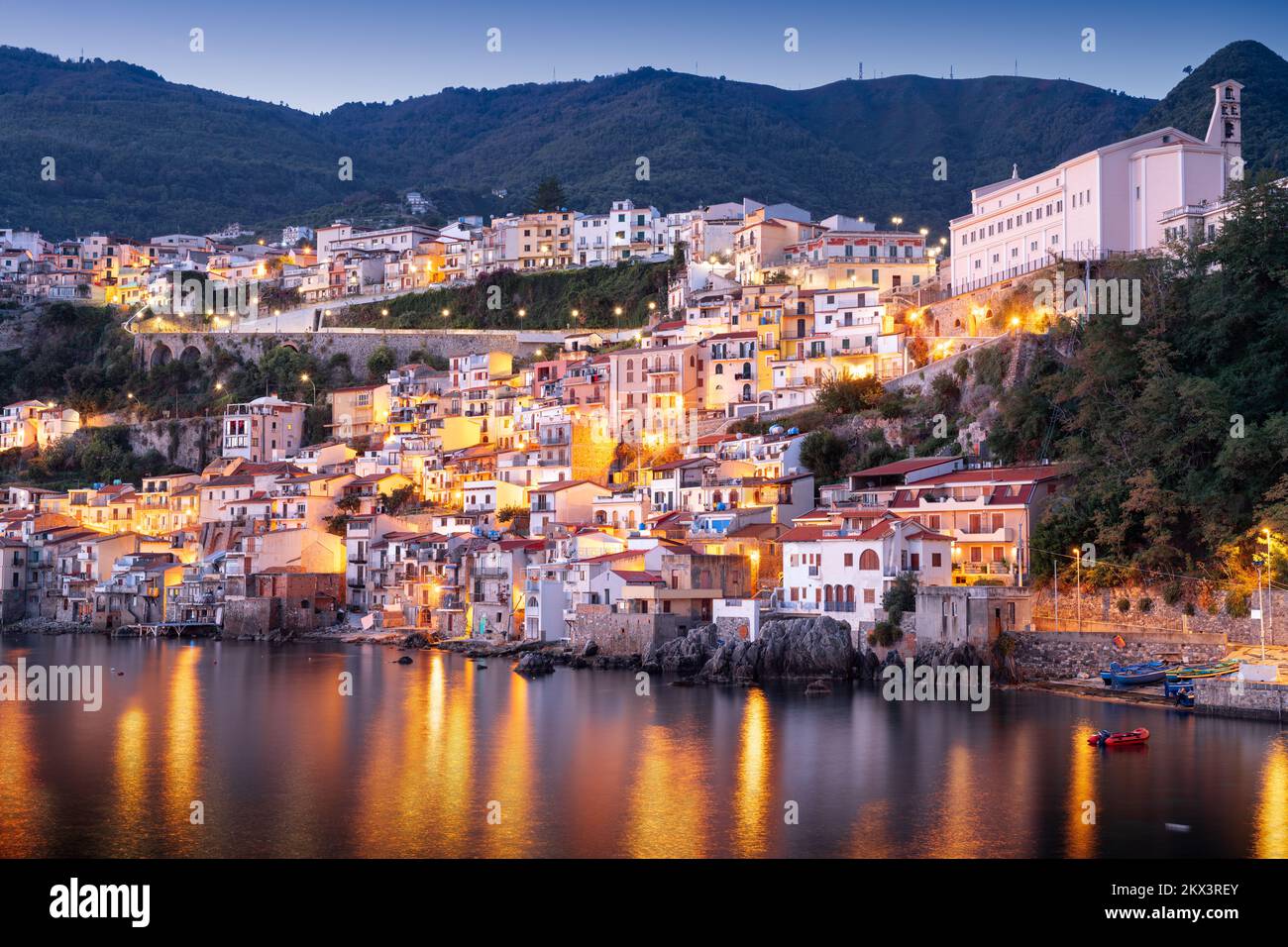 Scilla, Italy waterfront buildings at the port at dusk. Stock Photo
