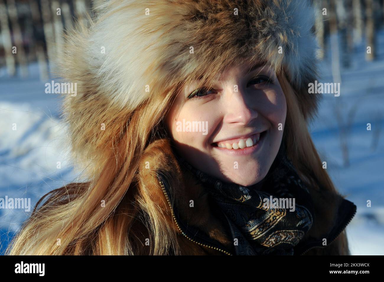 Outdoor portrait of young caucasian woman in fur hat Stock Photo - Alamy