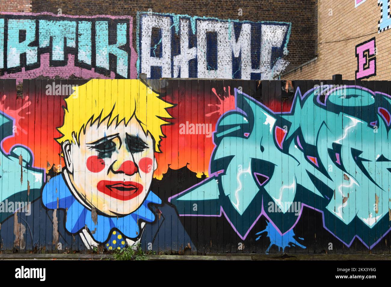 Boris Johnson as a clown street art painted on a fence in Fashion Street Spitalfields London Stock Photo