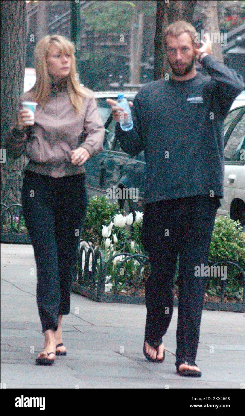 Gwyneth Paltrow and Chris Martin in Greenwich Village NYC, on their way to their Yoga class, only to find a parking ticket after leaving their Yoga studio. Stock Photo