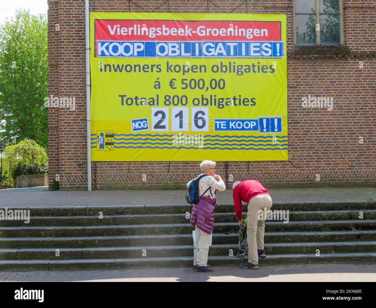 Netherlands, in the village Vierlingsbeek a church needs money for restoration and asks villagers to buy bonds (obligaties). In finance, a bond is a s Stock Photo
