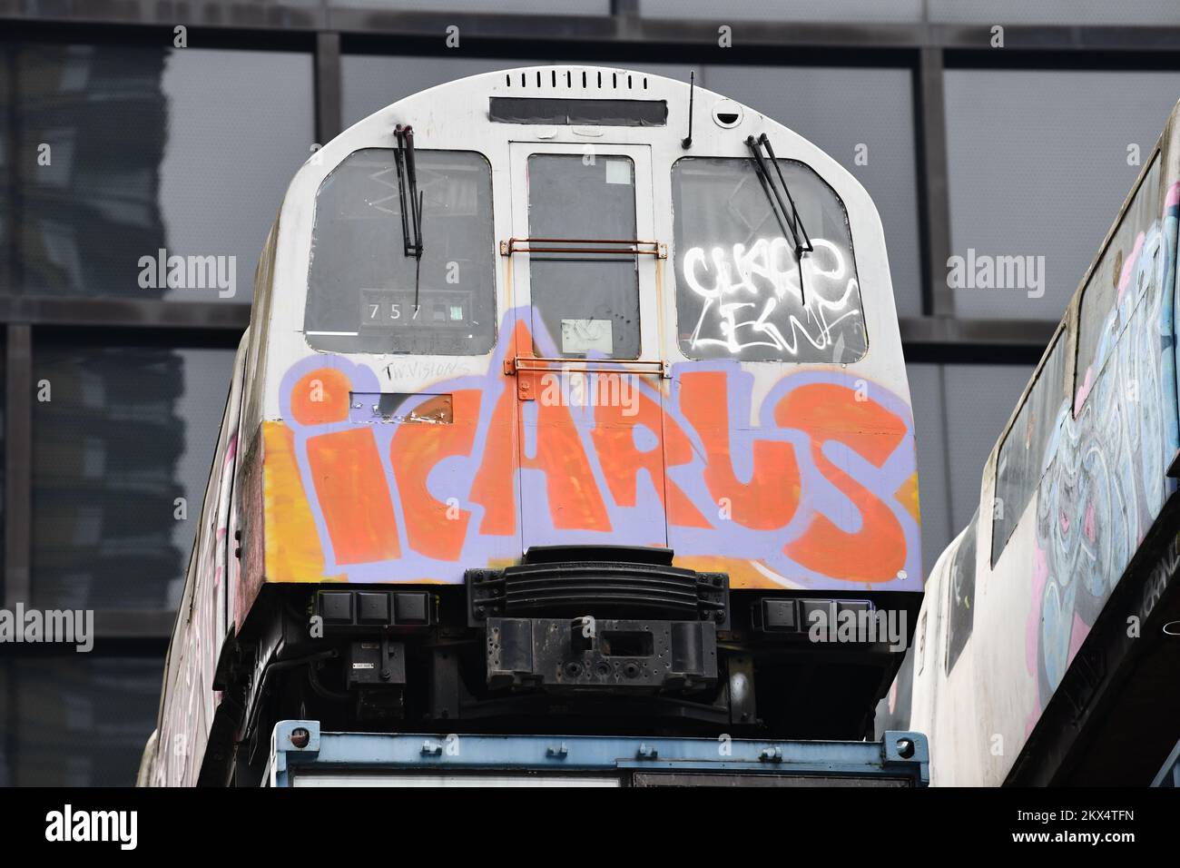 Tube train with graffiti and word Icarus on top of a building on Great Eastern Street in Shoreditch London Stock Photo