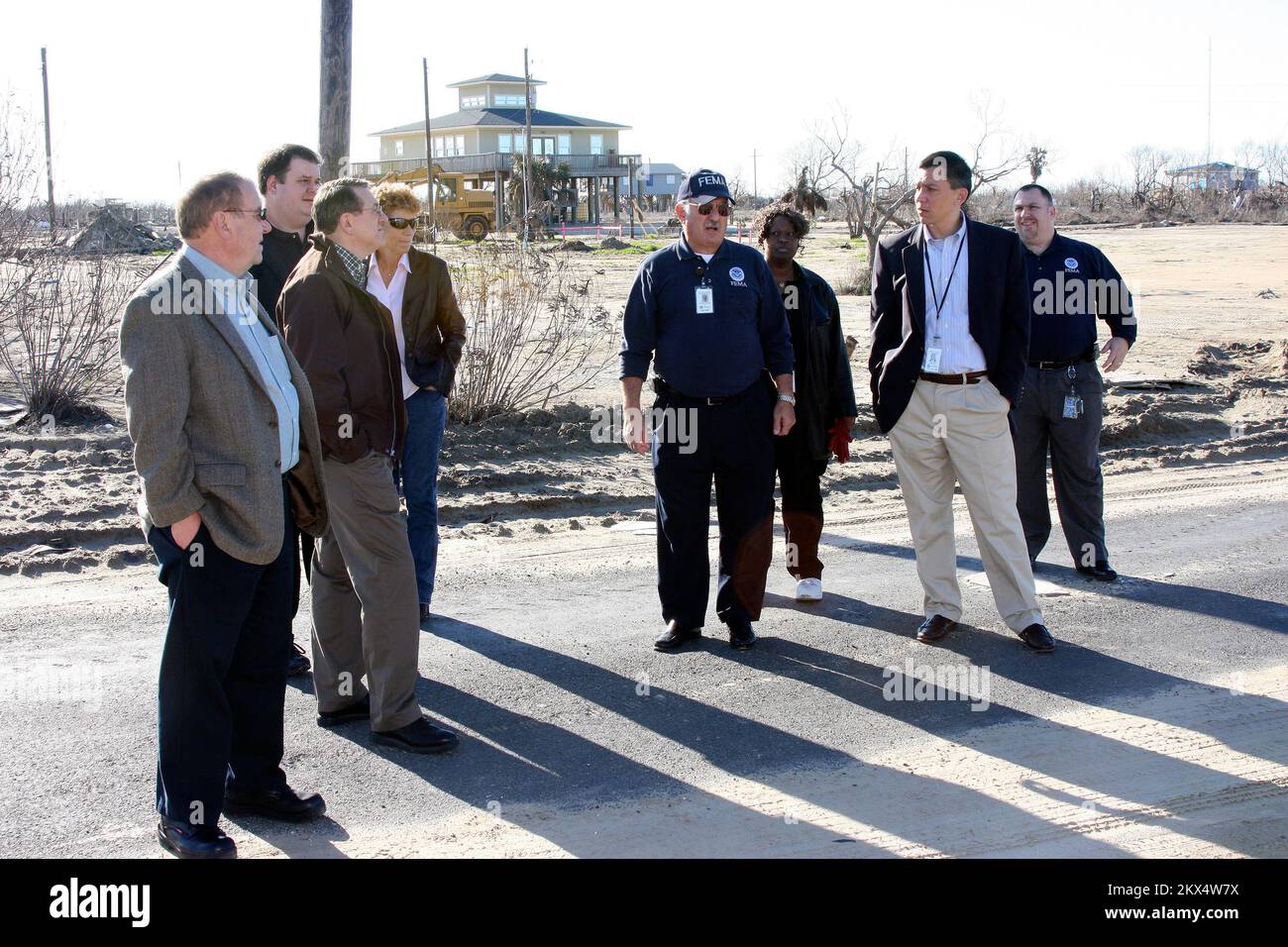 Hurricane/Tropical Storm - Bolivar, Texas, January 12, 2009   A group consisting of (left to right) FEMA Region 6 Comptrollers Steve Gwilliam and Chris Riley, former Acting Chief Financial Officer Bruce Redcay and Finance/Admin Section Chief/Comptroller Ginger Plummer, with FEMA Liason to Galveston Terence McAdler in the center followed by, Deputy Chief Financial Officer Lorna McAlister, Chief Financial Officer Norman Dong and J. J. Jenkins, Comptroller Cadre Manager, stop along their tour of Bolivar, Texas to see first hand the damage created by Hurricane Ike. Robert Kaufmann/FEMA. Texas Hurr Stock Photo