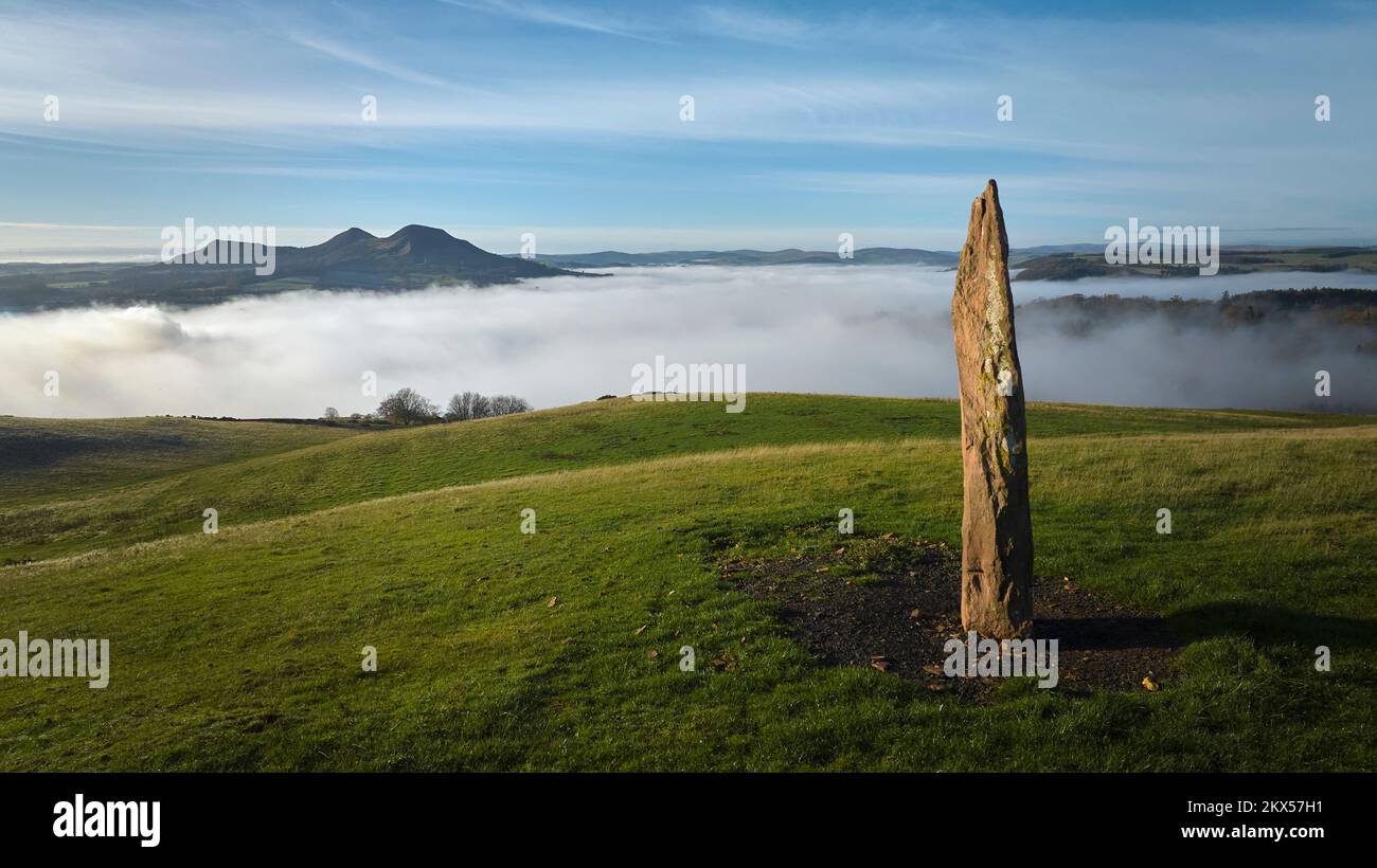 Standing Stone above Scott's View with temperature inversion shrouding the valley below on a sunny November day. Stock Photo