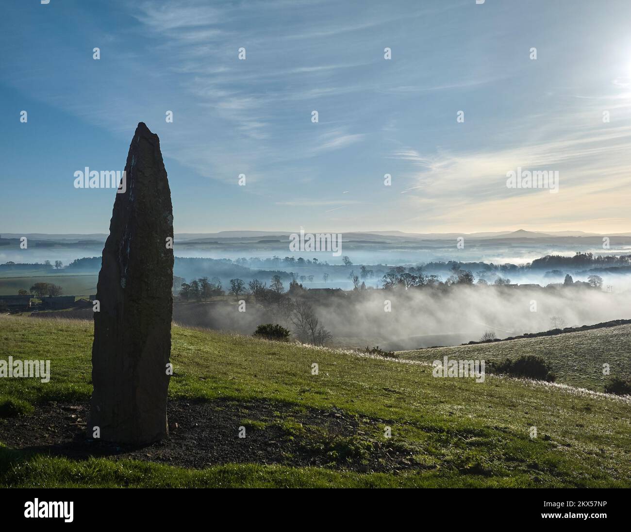 Standing Stone above Scott's View with temperature inversion shrouding the valley below on a sunny November day. Stock Photo