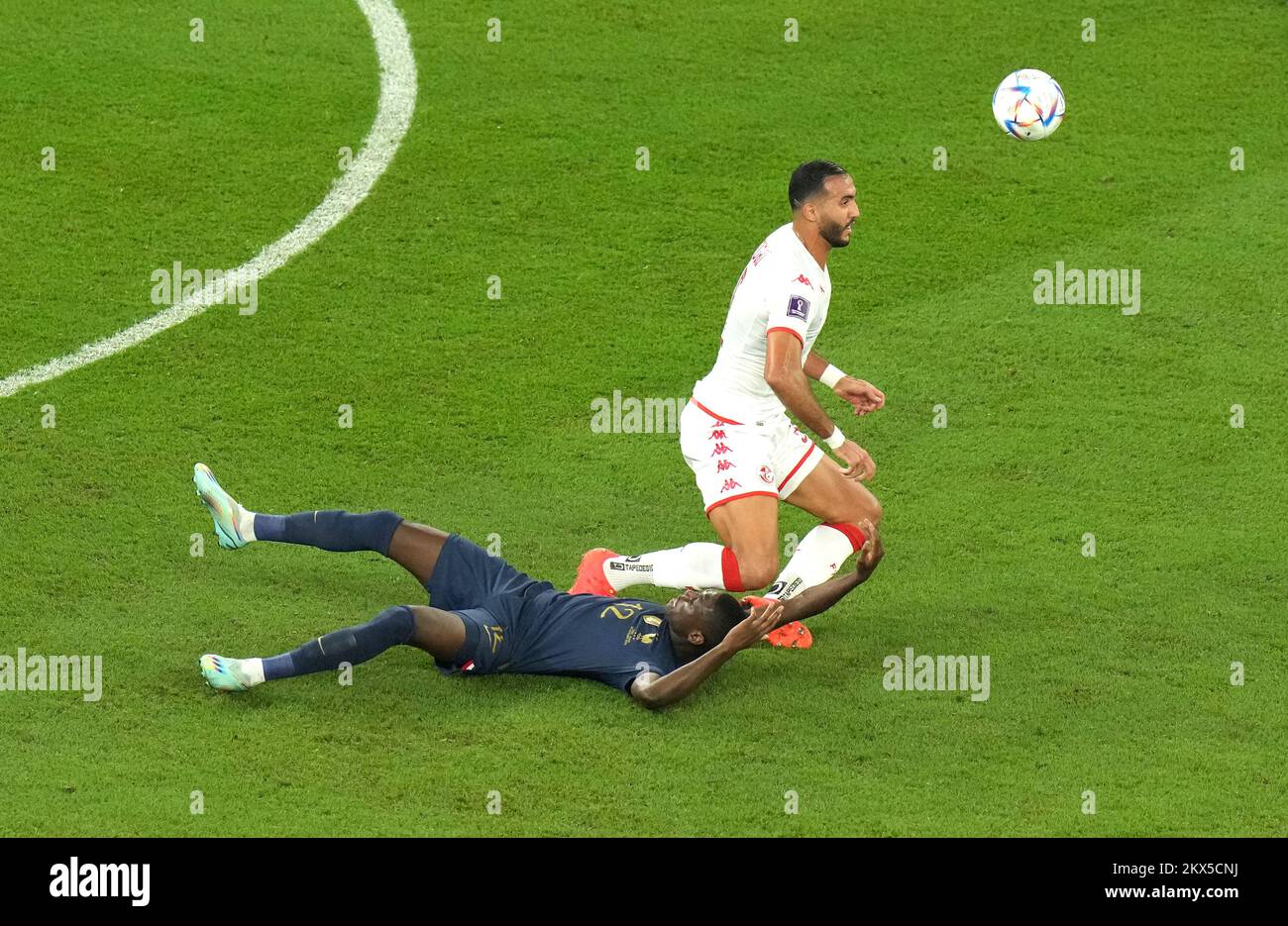 France's Randal Kolo Muani (left) and Tunisia's Nader Ghandri battle for the ball during the FIFA World Cup Group D match at the Education City Stadium in Al Rayyan, Qatar. Picture date: Wednesday November 30, 2022. Stock Photo
