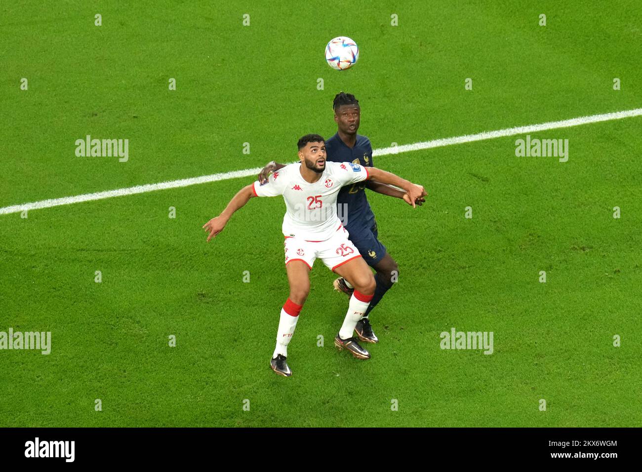 Tunisia's Anis Ben Slimane (left) and France's Eduardo Camavinga battle for the ball during the FIFA World Cup Group D match at the Education City Stadium in Al Rayyan, Qatar. Picture date: Wednesday November 30, 2022. Stock Photo