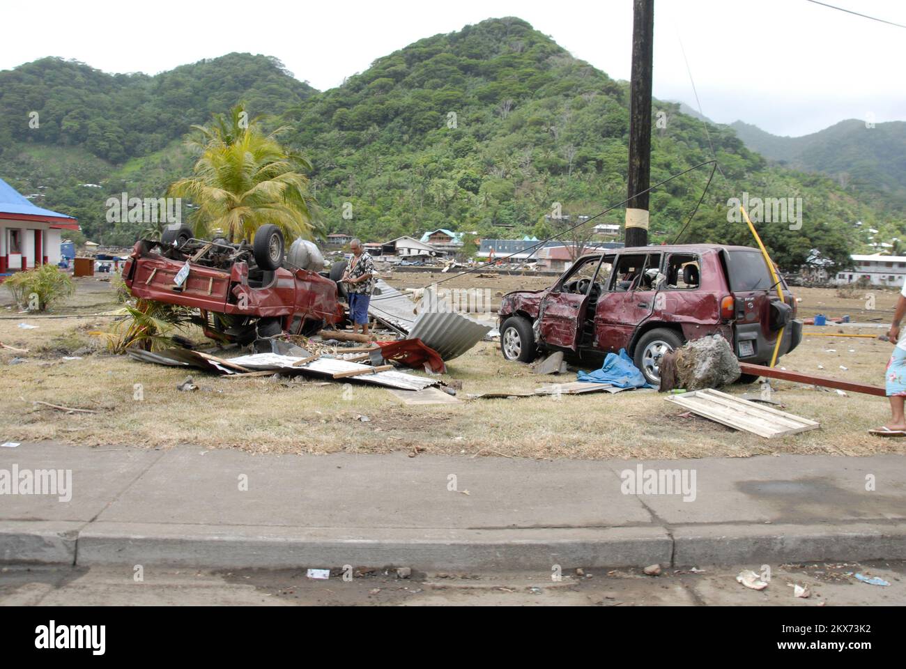 Earthquake   Tsunami - Pago Pago, American Samoa, October 1, 2009   Pago Pago, October 1, 2009 - A resident of American Samopa two cars that were damaged by the tsumani that hit American Samoa.. American Samoa Earthquake, Tsunami, and Flooding. Photographs Relating to Disasters and Emergency Management Programs, Activities, and Officials Stock Photo