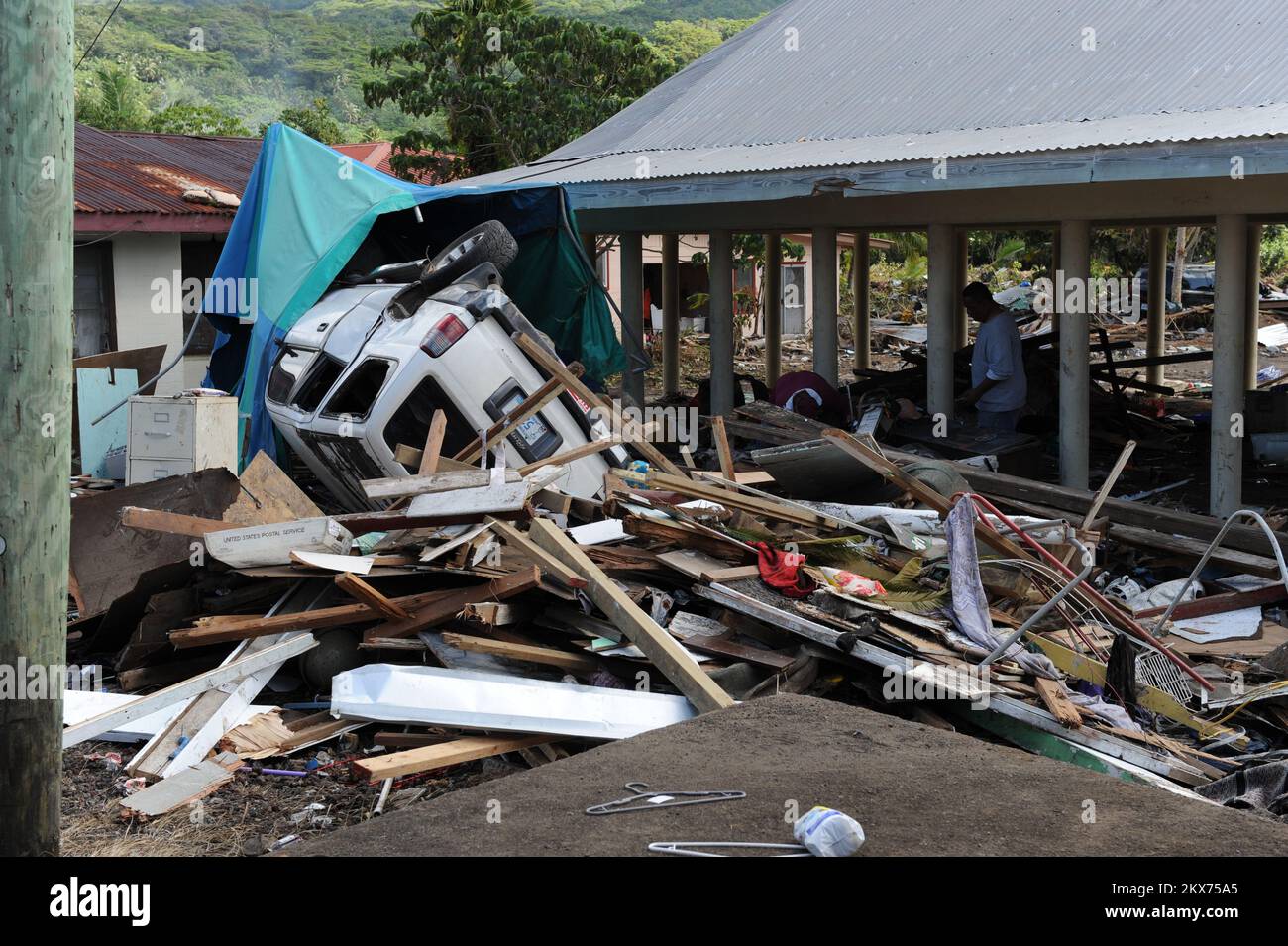 Earthquake   Tsunami - Leone, American Samoa, October 2, 2009   A car sits upside down among other debris that was caused by the recent earthquake and tsunami in American Samoa. The tsunami spread debris throughout the village of Leone. American Samoa Earthquake, Tsunami, and Flooding. Photographs Relating to Disasters and Emergency Management Programs, Activities, and Officials Stock Photo