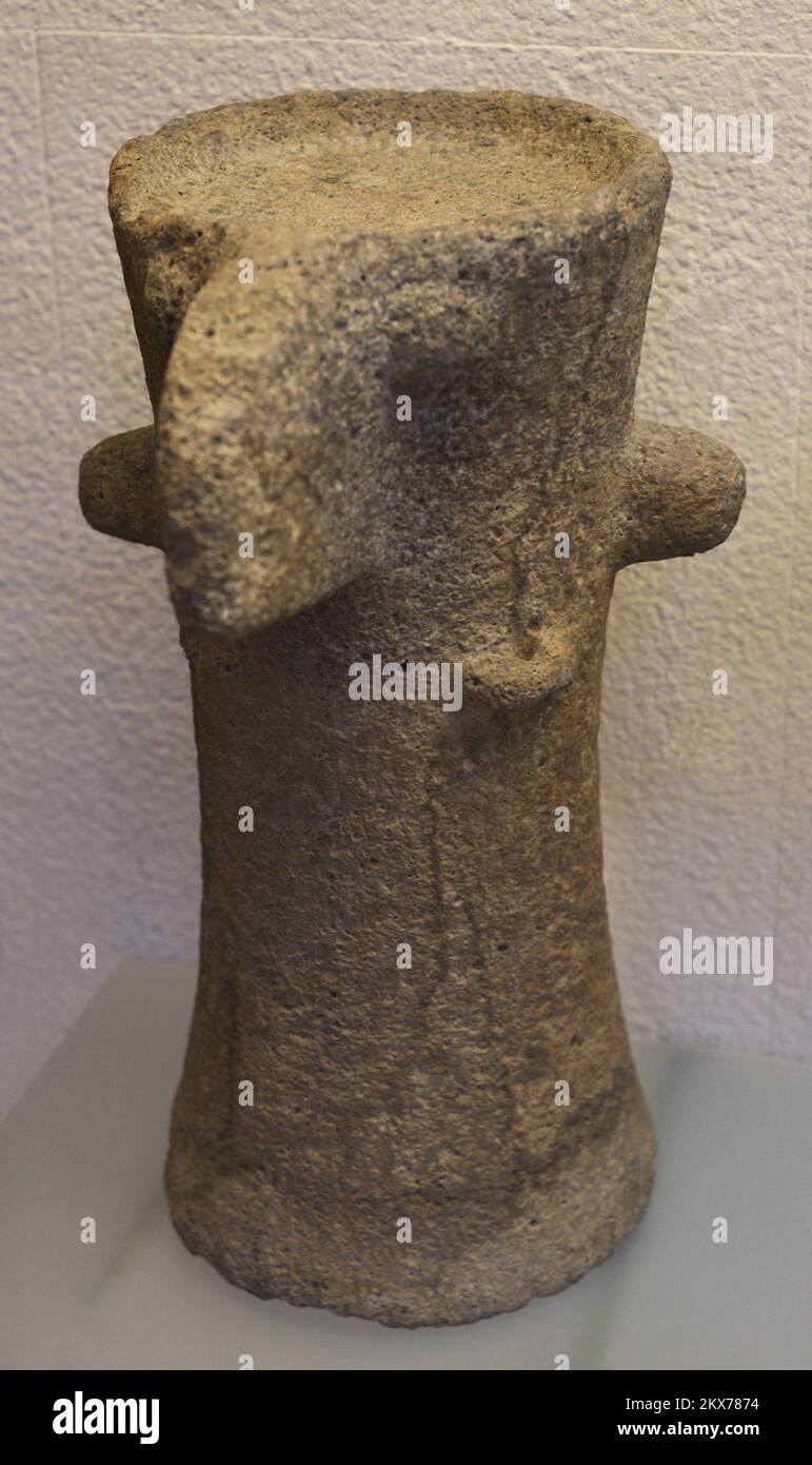 Anthropomorphic domestic idol-altar. Chalcolithic. 4th millennium BC. Basalt. Cylindrical in shape with handles. The upper part has a small deposit for offerings. It was placed inside dwellings. From the Golan Heights (Middle East). Sephardic Museum. Toledo. Castile-La Mancha. Spain. Stock Photo