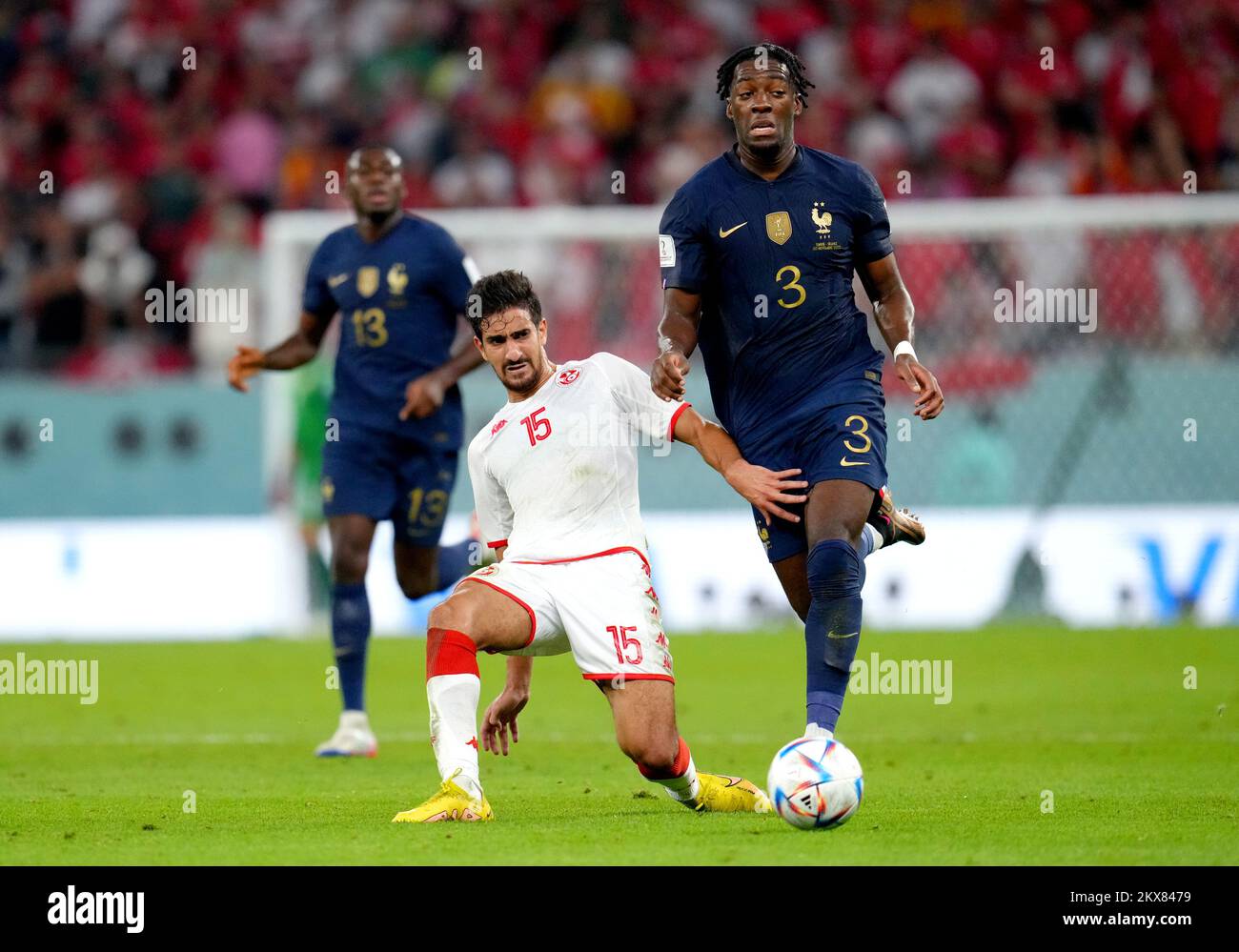 Tunisia's Mohamed Ali Ben Romdhane (left) and France's Axel Disasi battle for the ball during the FIFA World Cup Group D match at the Education City Stadium in Al Rayyan, Qatar. Picture date: Wednesday November 30, 2022. Stock Photo