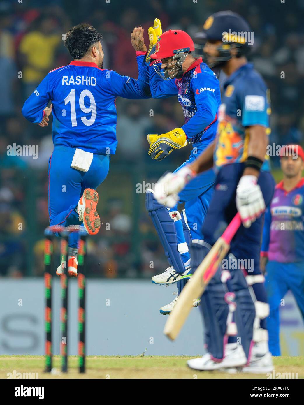Kandy, Sri Lanka. 30th November 2022. Rashid Khan of Afghanistan celebrates with team mates