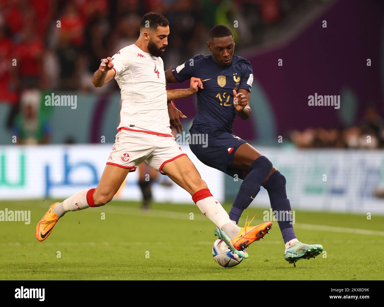 Ar Rayyan, Qatar, 30th November 2022. Yassine Meriah of Tunisia tackles Christopher Nkunku of France  during the FIFA World Cup 2022 match at Education City Stadium, Ar Rayyan. Picture credit should read: David Klein / Sportimage Credit: Sportimage/Alamy Live News Stock Photo