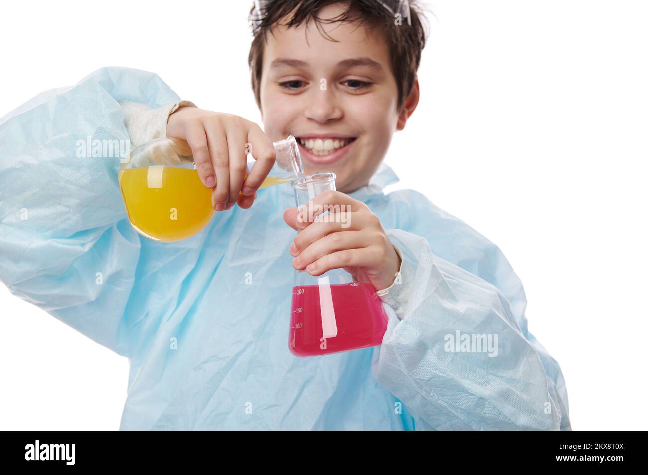 Selective focus on laboratory glass flasks in the hands of a cute ...