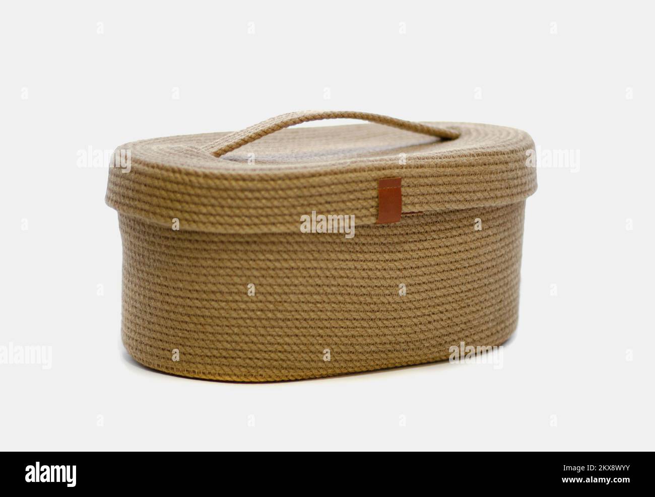 Wicker basket with jute lid on white isolated background Stock Photo ...