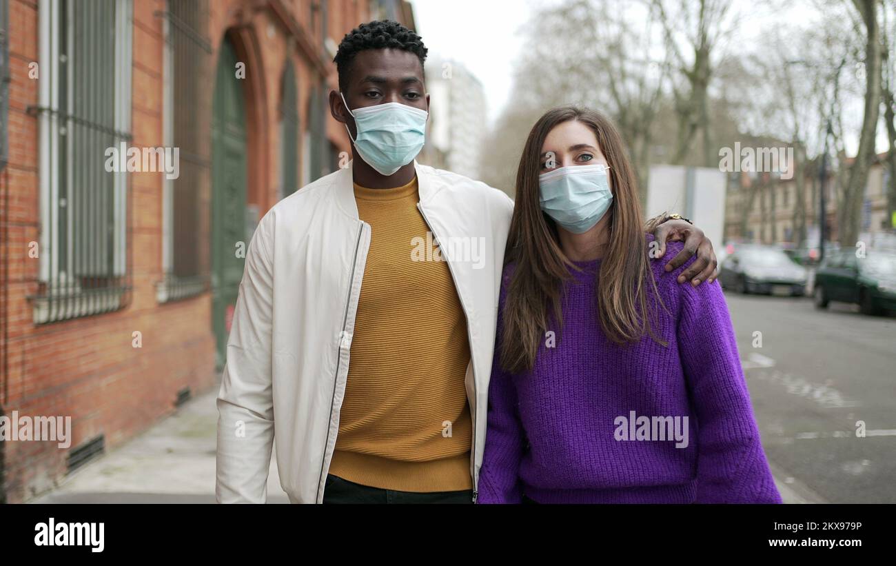Interracial couple wearing medical masks hi-res stock photography and ...