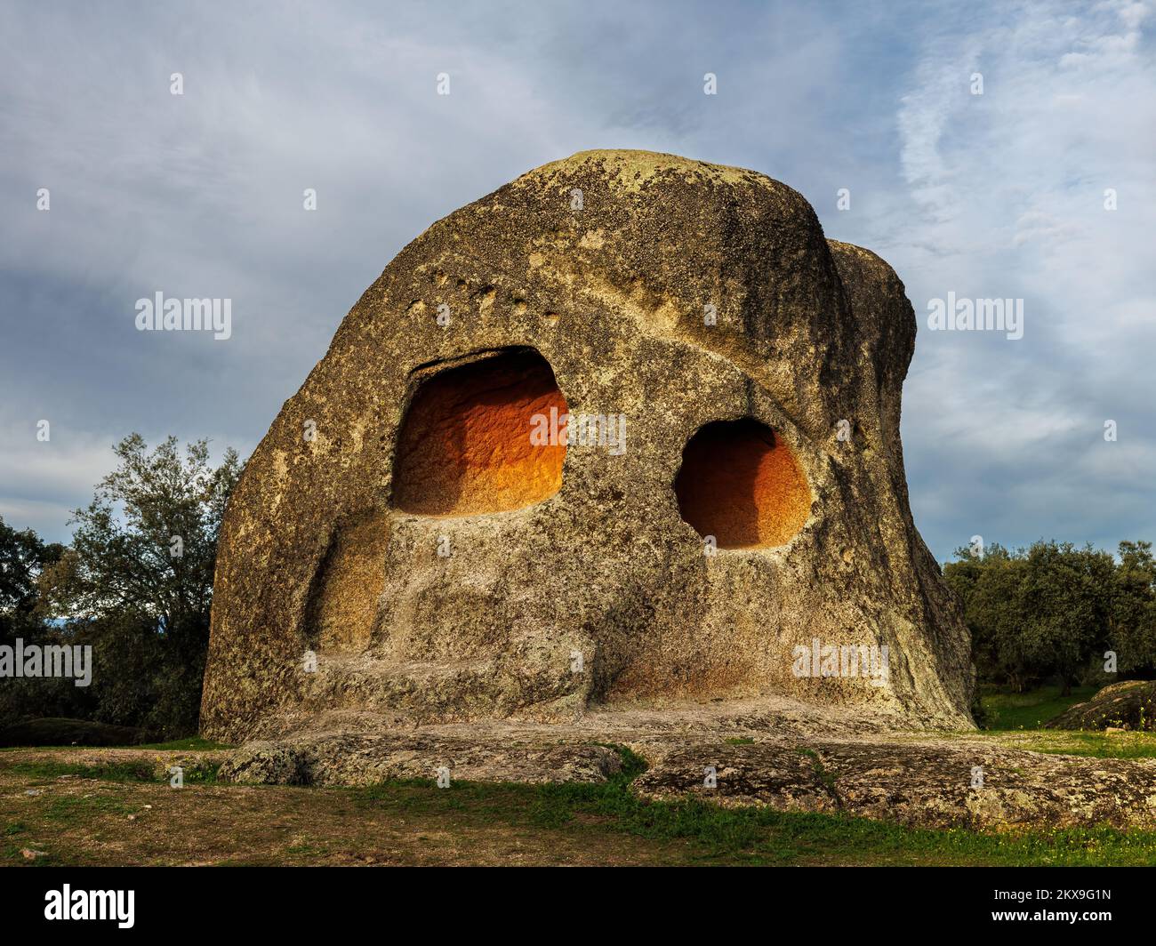 Canchal de los Ojos is a singular rock with two cavities similar to eyes. Ancient prehistoric temple located in Piedras Albas. Spain. Stock Photo