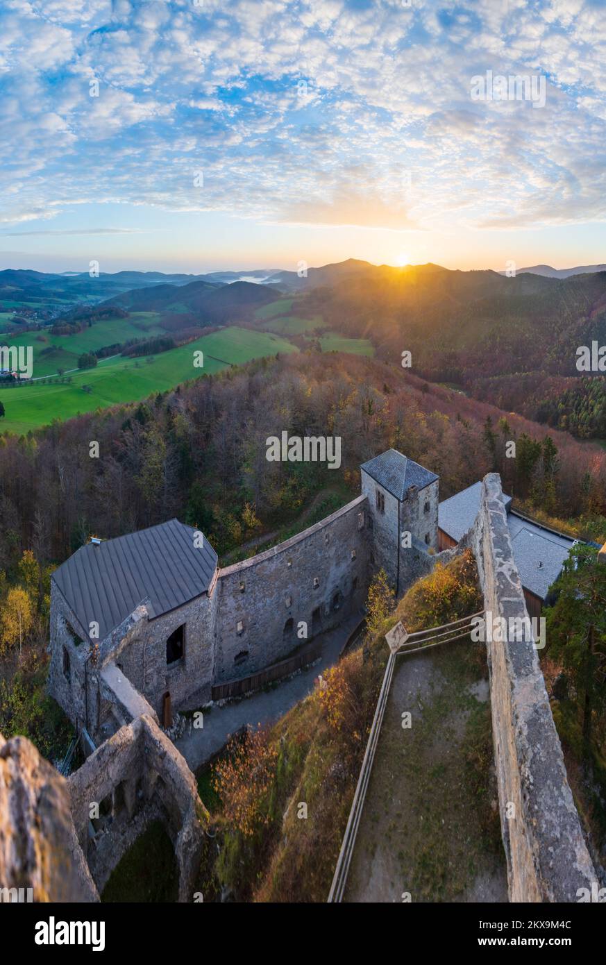 Kaumberg: sunrise at Araburg Castle in valley Triestingtal,  mountain Hocheck, view from castle tower in Mostviertel, Niederösterreich, Lower Austria, Stock Photo