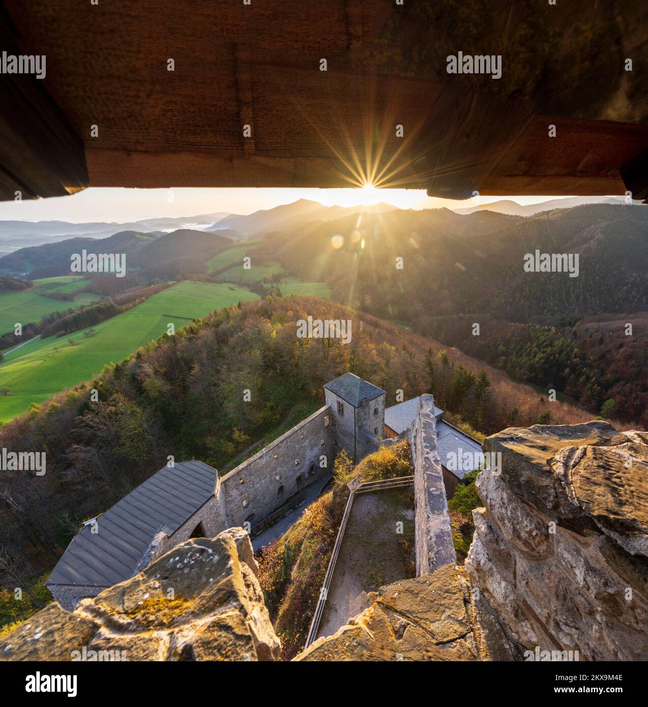 Kaumberg: sunrise at Araburg Castle in valley Triestingtal,  mountain Hocheck, view from castle tower in Mostviertel, Niederösterreich, Lower Austria, Stock Photo