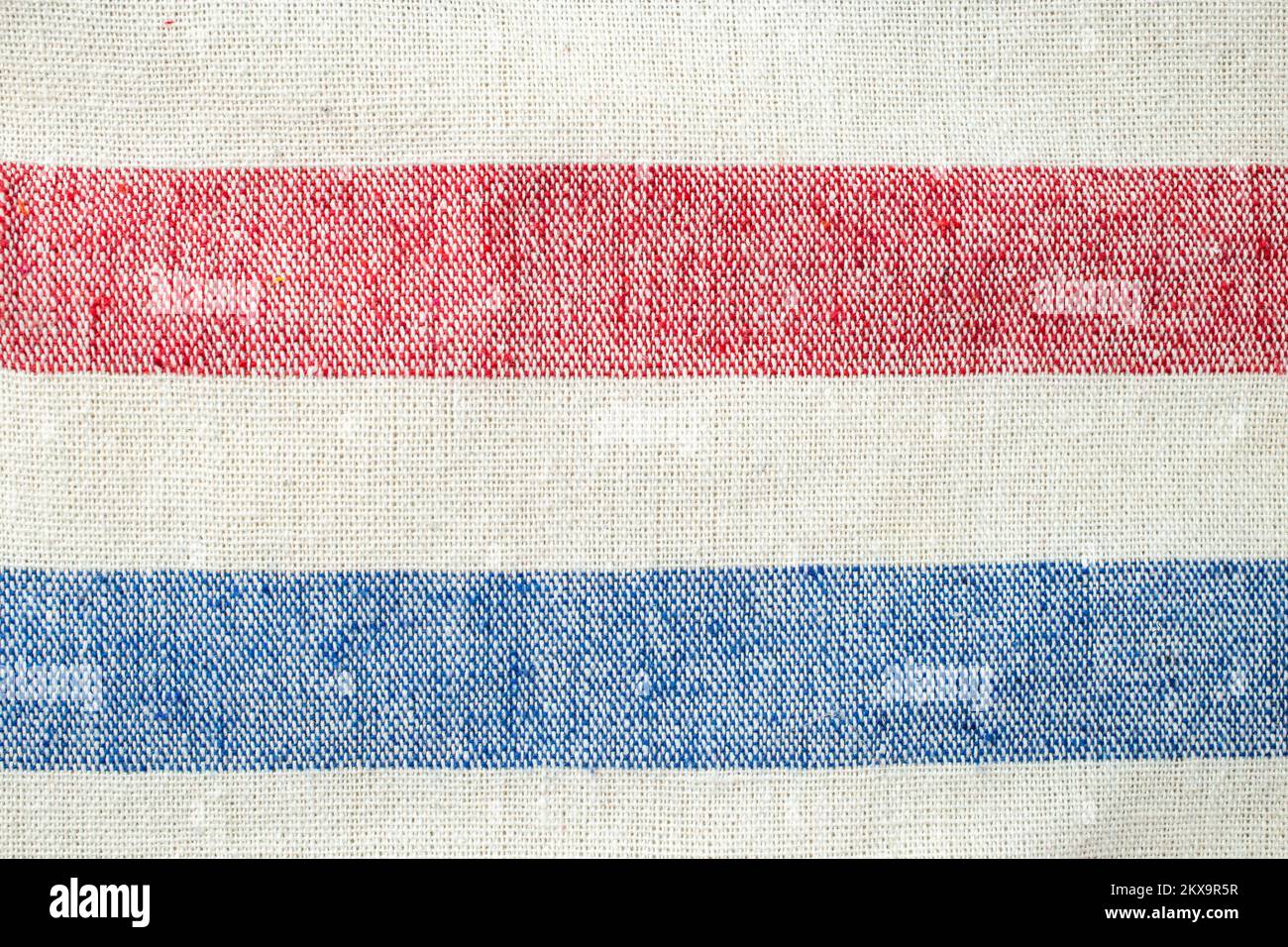 Horizontal lines, red, white and blue. Thick fabric canvas, soft focus close up Stock Photo
