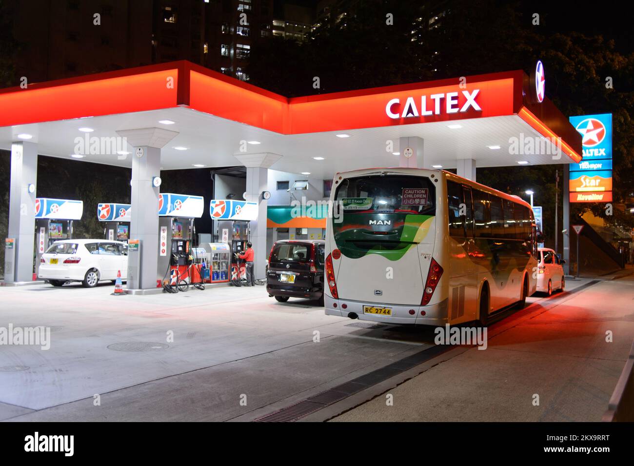 HONG KONG - APRIL 15, 2015: Caltex fuel station at evening. Caltex is a petroleum brand name of Chevron Corporation used in more than 60 countries in Stock Photo