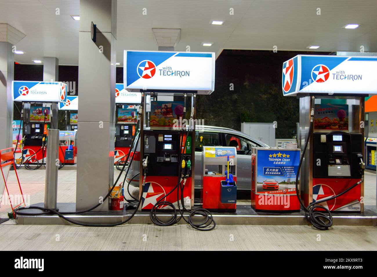 HONG KONG - APRIL 15, 2015: Caltex fuel station at evening. Caltex is a petroleum brand name of Chevron Corporation used in more than 60 countries in Stock Photo