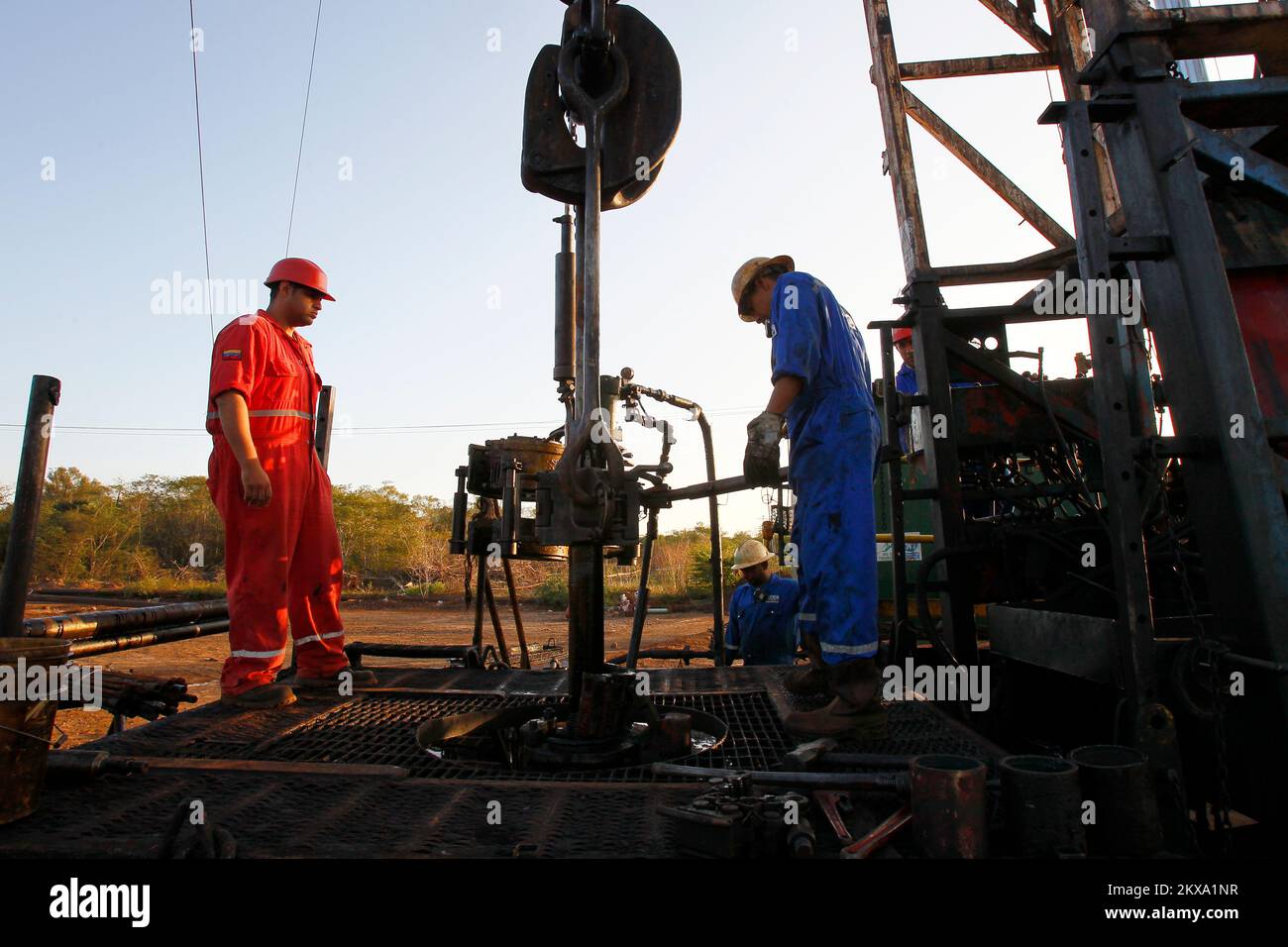Workers of the State Oil Company of Venezuela, drill a crude well in an