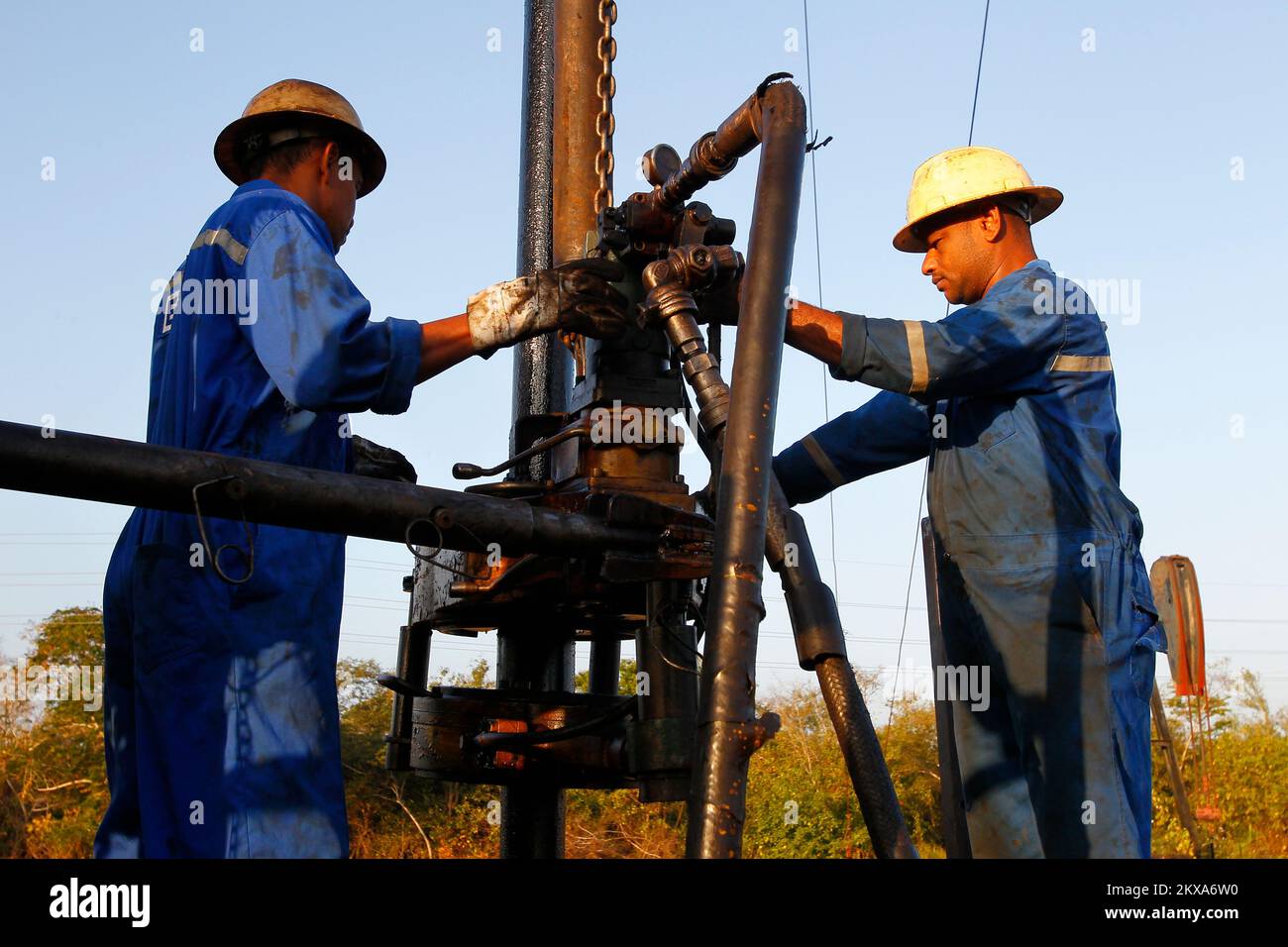 Workers of the State Oil Company of Venezuela, drill a crude well in an