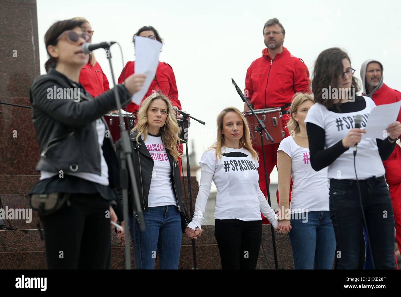 16.03.2019., King Tomislav Square. Zagreb, Croatia - Supporters of the #spasime (#saveme) social network movement carry a sing during a protest against domestic violence. Organizer of the #Spasime (#Saveme) campaign, Croatian actress and producer Jelena Veljaca. Photo: Dalibor Urukalovic/PIXSELL Stock Photo
