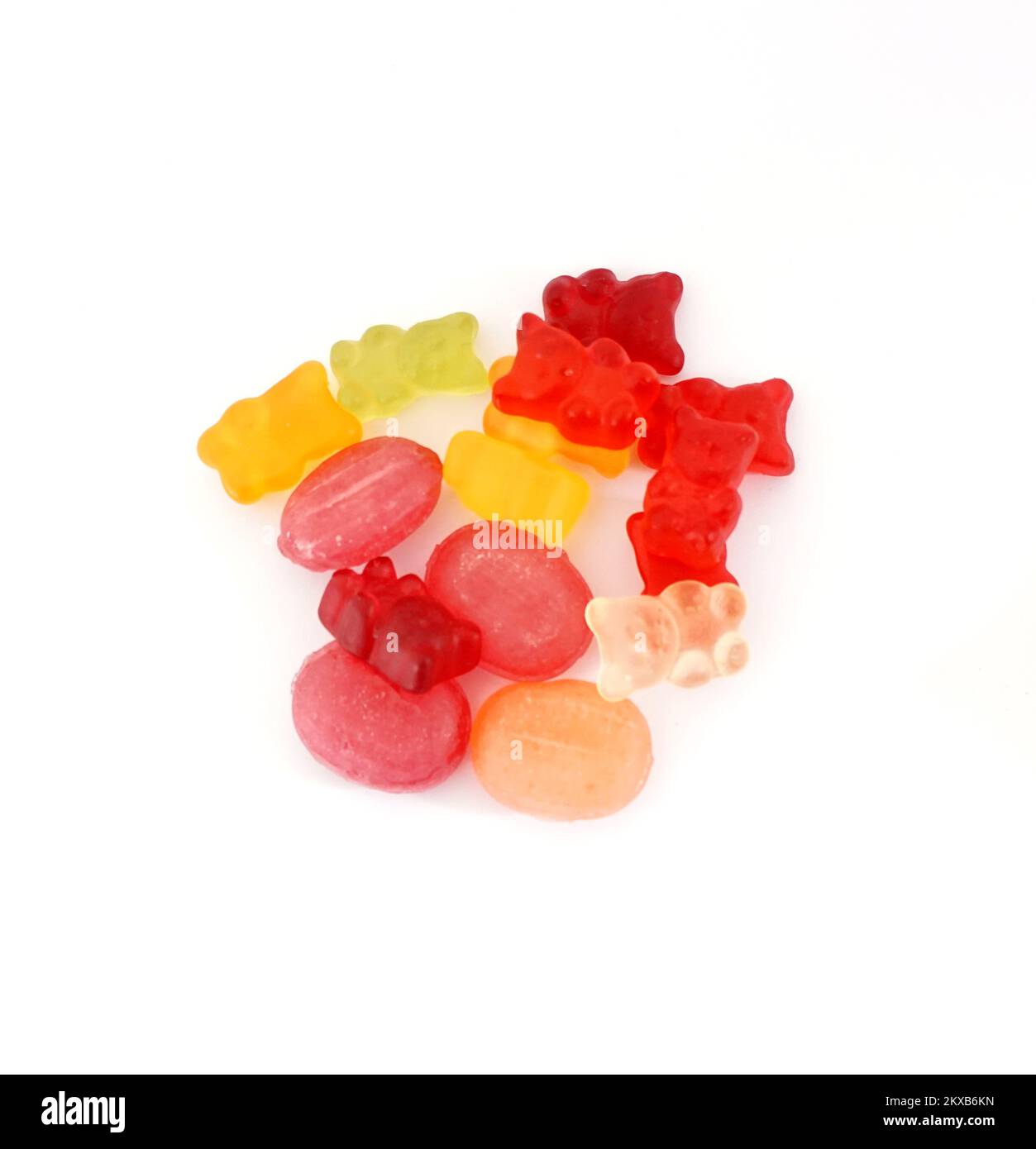 Group of colored hard and jelly gummy candies isolated on a white