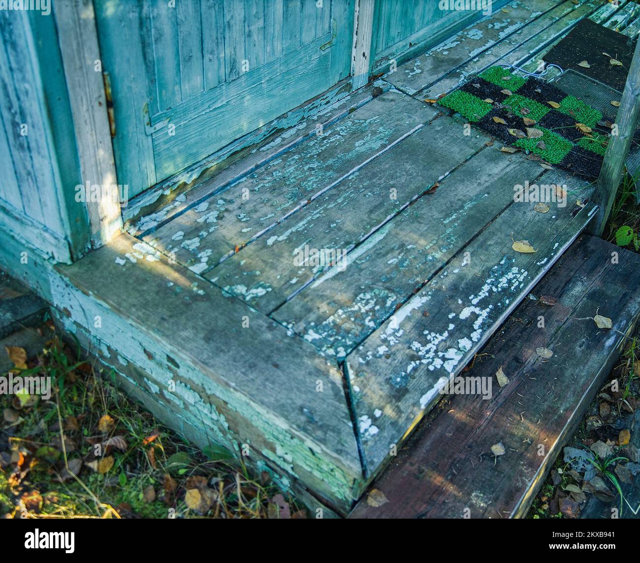 peeling paint on the house entrance and old porch, focus in the