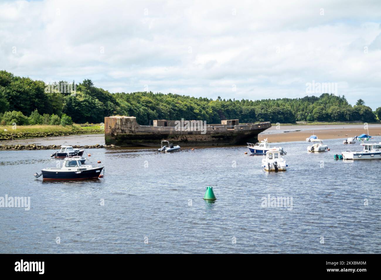 BALLINA, IRELAND - JULY 15 2022 - Concrete ship lying on river Moy. Stock Photo