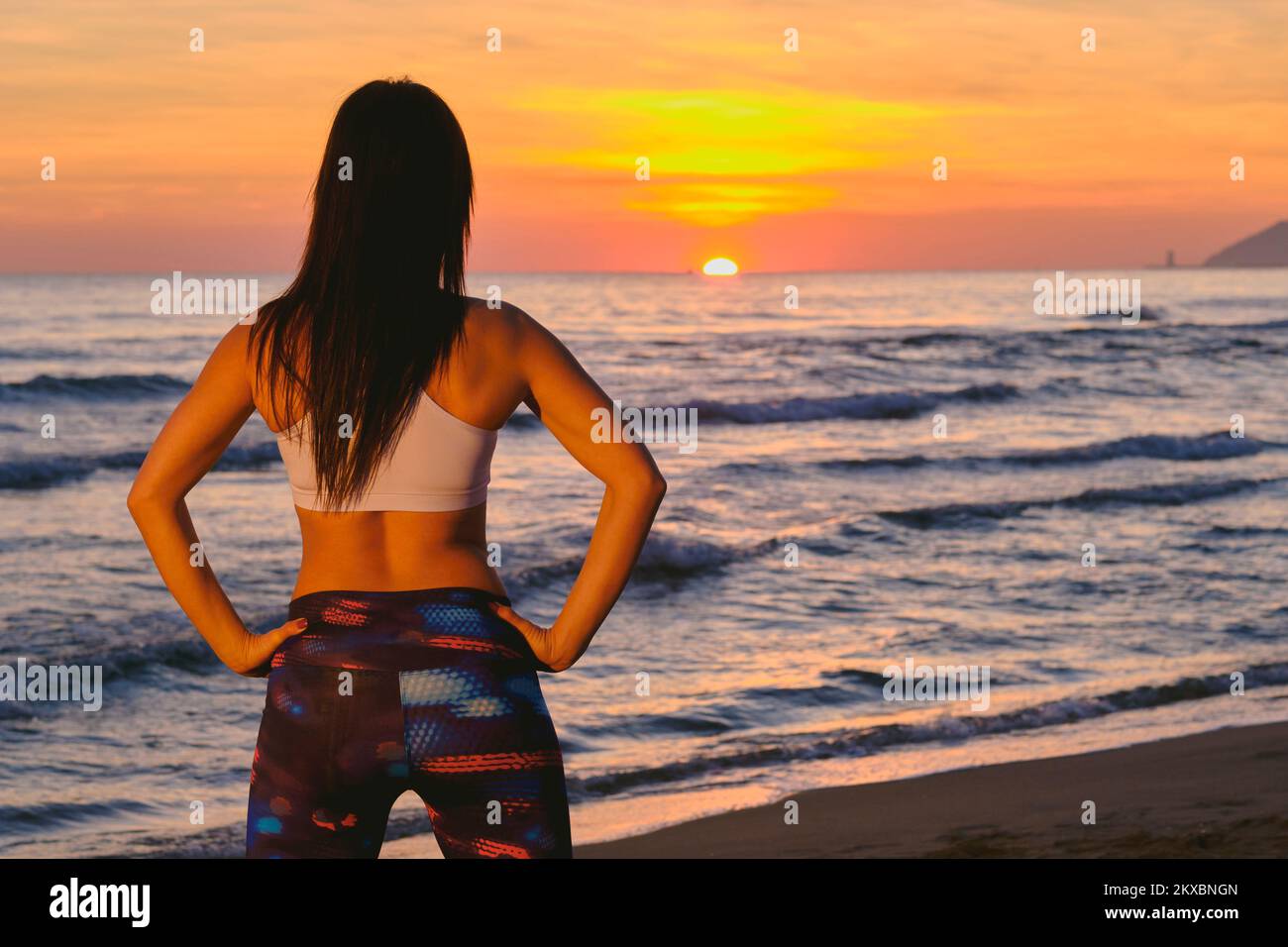 Sportive woman watching sunset hi-res stock photography and images - Alamy