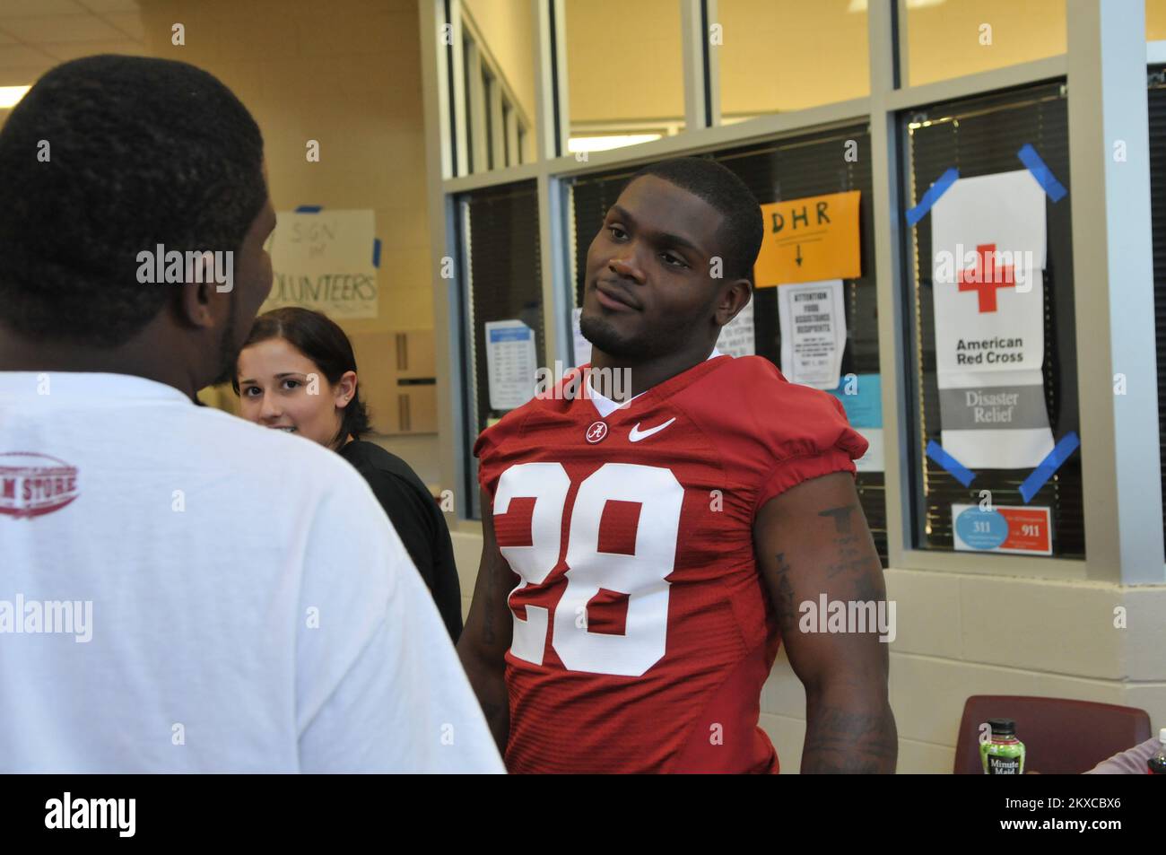 Tornado - Tuscaloosa, Ala. , May 6, 2011   University of Alabama Football All-American Javier Arenas chats with a fan at the Tuscaloosa Red Cross Shelter. Javier passed out FEMA registration flyers, signed autographs, and posed for pictures with fans to help raise the spirits of people who have lost nearly everything. FEMA Photo /Tim Burkitt. Alabama Severe Storms, Tornadoes, Straight-line Winds, and Flooding. Photographs Relating to Disasters and Emergency Management Programs, Activities, and Officials Stock Photo
