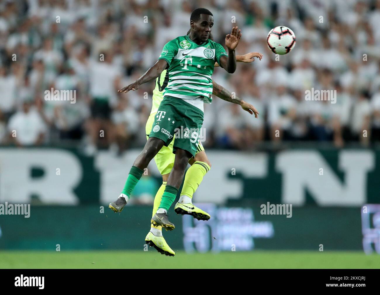 BUDAPEST, HUNGARY - AUGUST 13: (l-r) Tokmac Chol Nguen of Ferencvarosi TC  wins the ball from Arijan Ademi of GNK Dinamo Zagreb during the UEFA  Champions League Third Qualifying Round match between