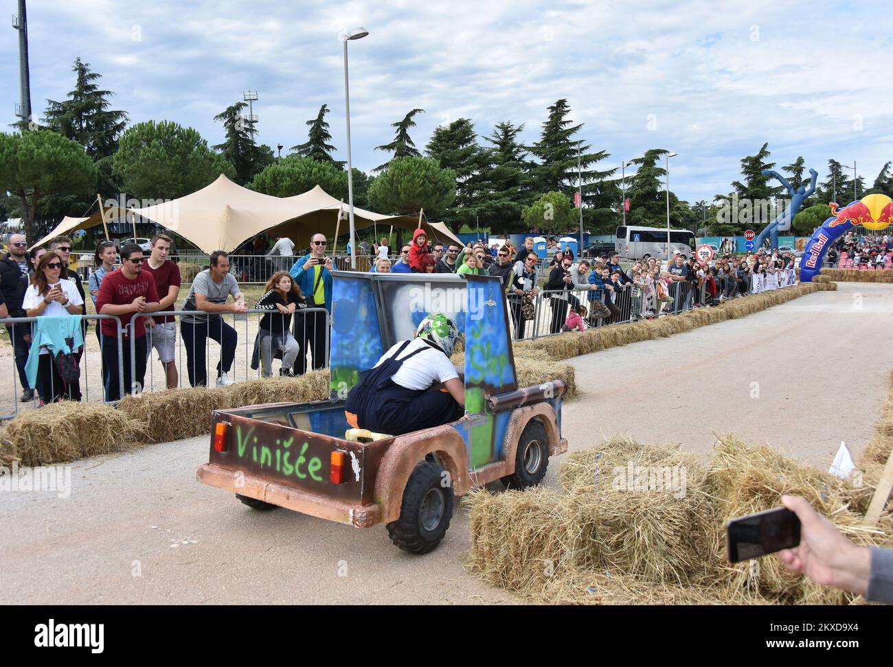 A competitors drives their homemade vehicles without an engine during ...