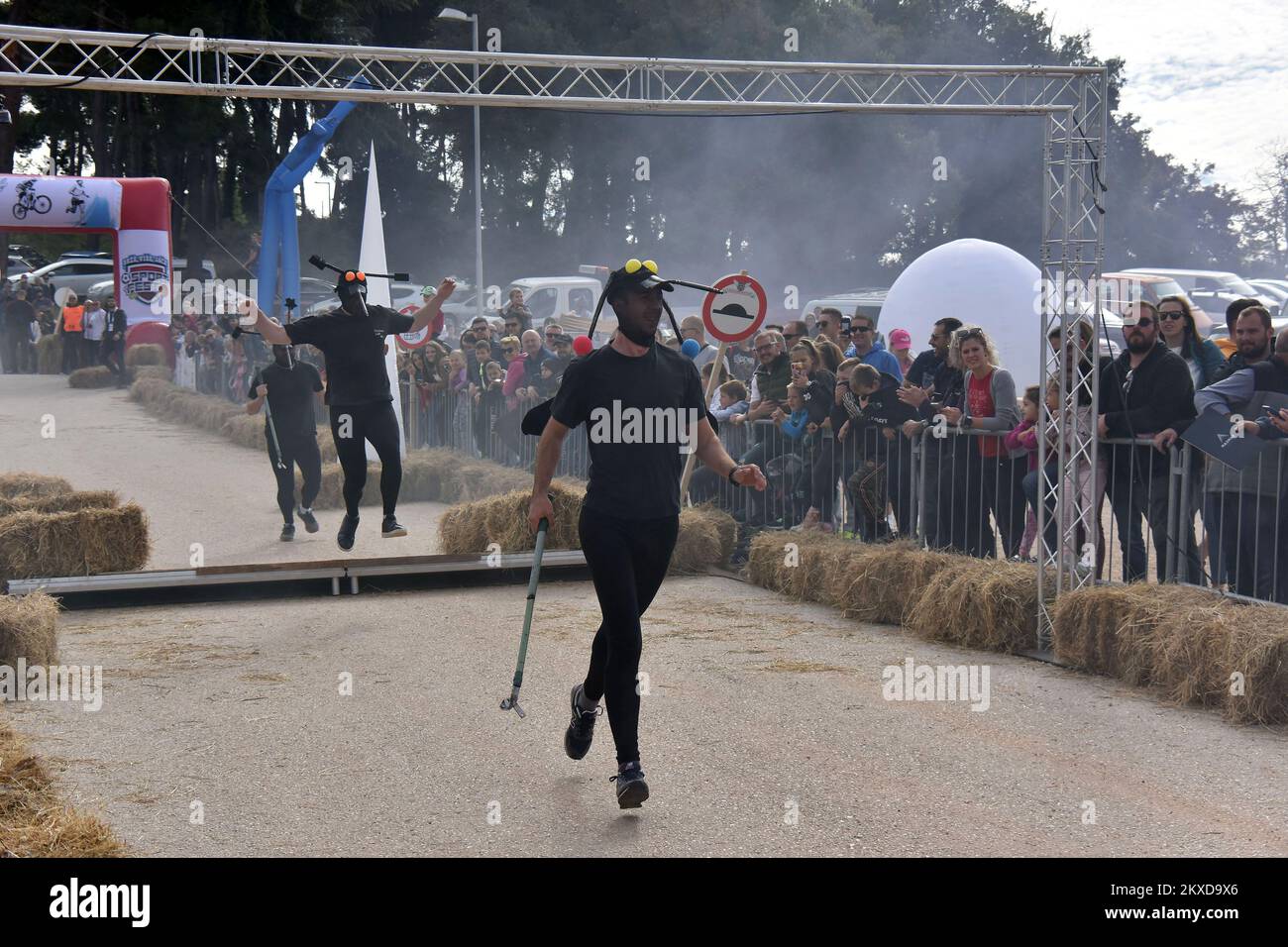 A competitors drives their homemade vehicles without an engine during ...