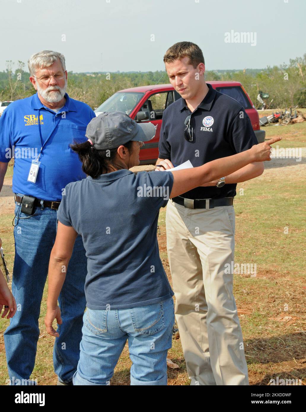 Tornado - Cashion, Okla. , May 27, 2011   FEMA's Brian Williams, and John R. Simmons of the U. S. Small Business Administration (SBA) speak with a tornado survivor during a Preliminary Damage Assessment.  .. Photographs Relating to Disasters and Emergency Management Programs, Activities, and Officials Stock Photo
