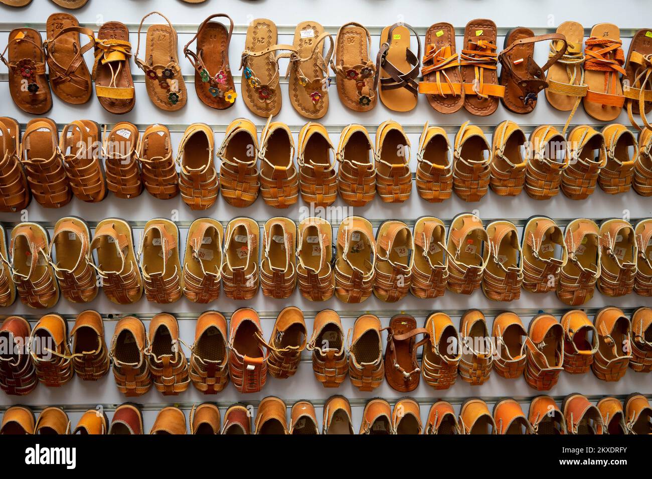 Wall of leather sandals in a craft store in Jinotega, Nicaragua Stock Photo