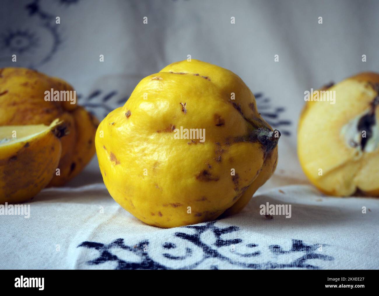 Quinces standing on a white background with black motifs. Stock Photo