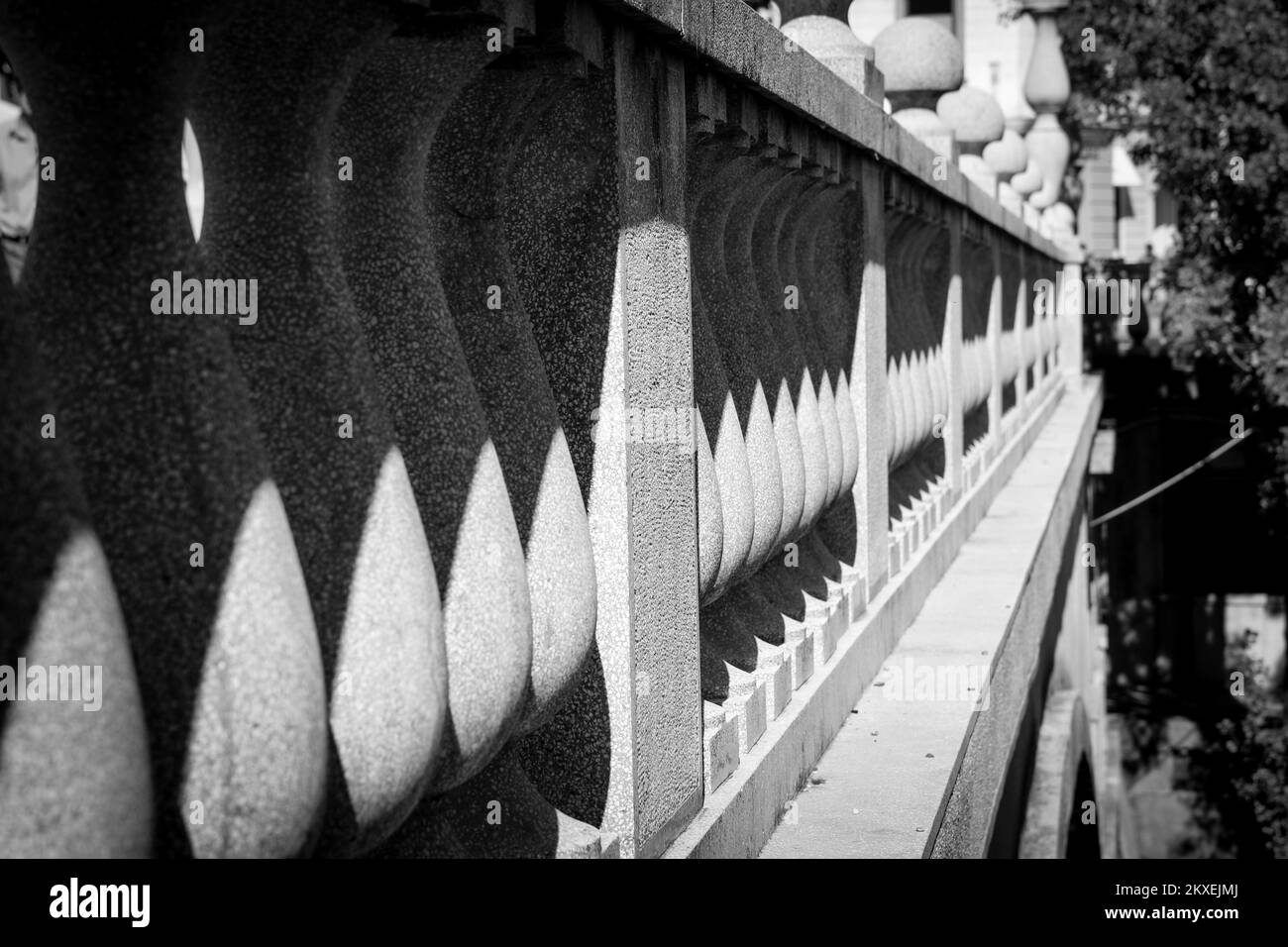The contrast black and white detail of the columns of the banister on the old bridge in Ljubljana in Slovenia. Stock Photo