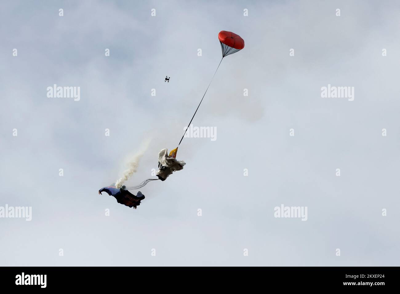 Spanish skydiver Dani Roman opens his parachute as he flies with a ...